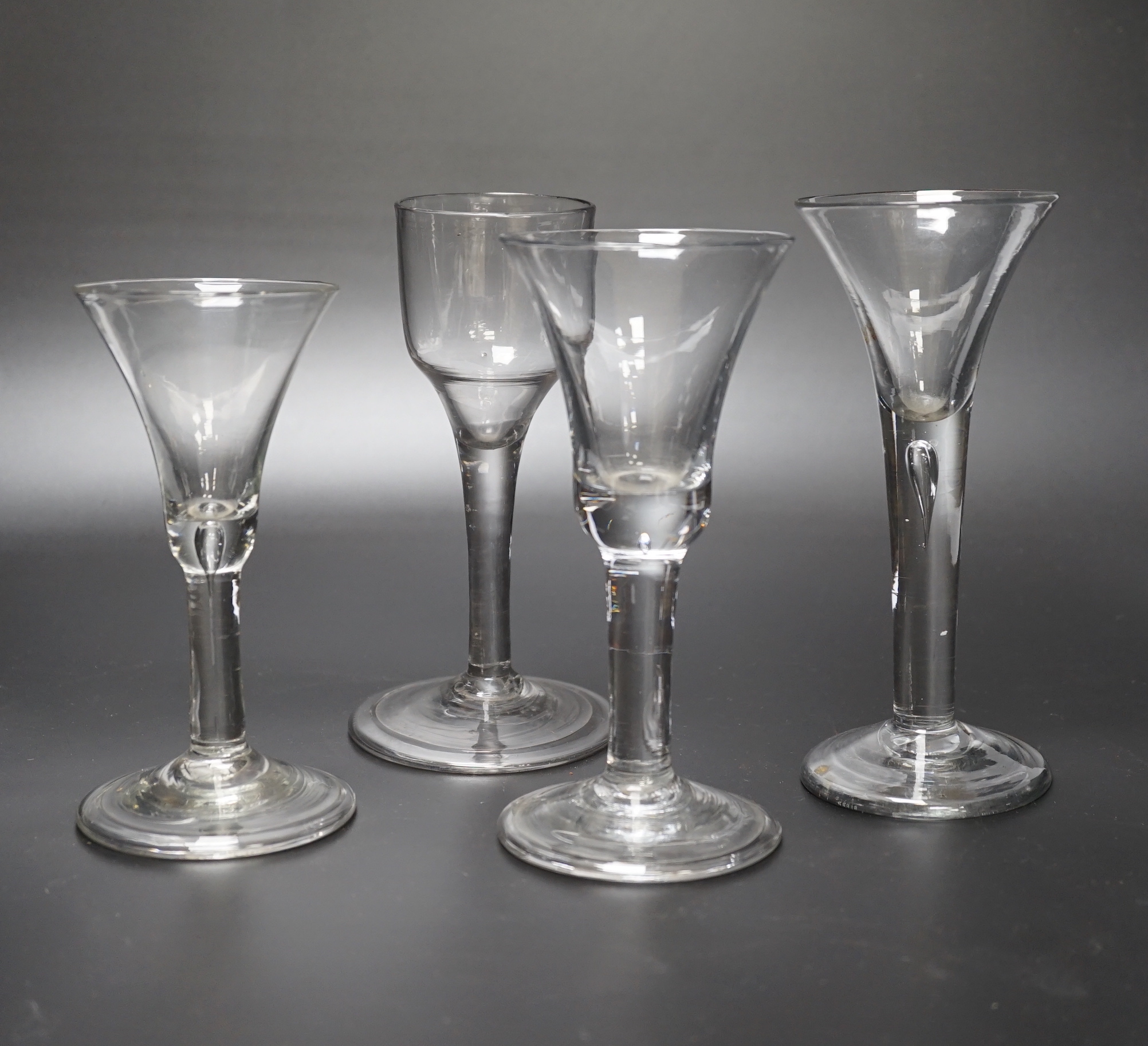 A group of four Georgian wine glasses, c.1740-50, tallest 16.8cm